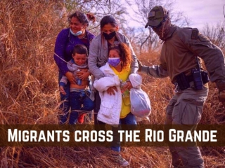 Migrants cross the Rio Grande